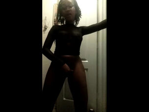 Ebony chick unwraps her miniskirt in the dark