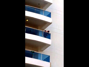 Hidden cam of duo on balcony
