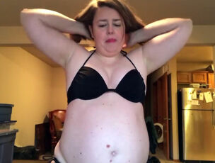 Fatty mother attempting bathing suit at home