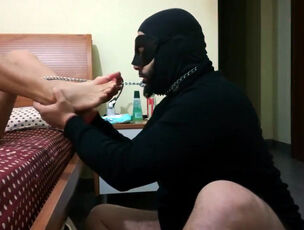 Fetish boy victim in mask munches soles of his domina
